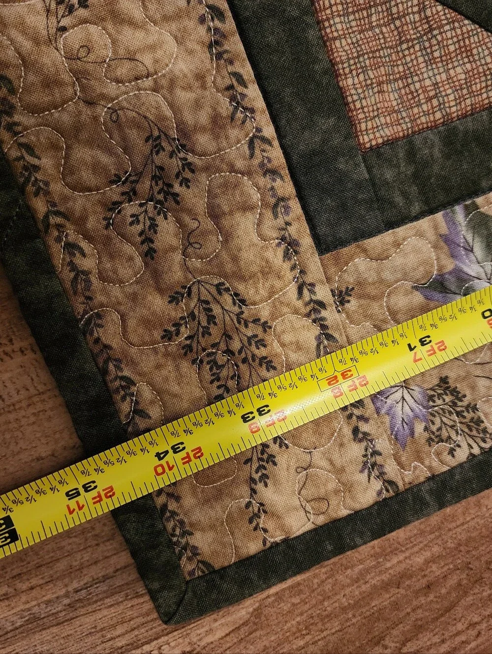 Green, brown and beige quilted table topper